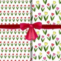 Set of vector seamless patterns with tulips and realistic red bow. Royalty Free Stock Photo