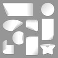 Set of vector white paper stickers of different shapes with curled corners isolated on white background. Royalty Free Stock Photo