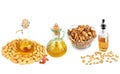 Set of vegetable oils, nuts and seeds isolated on white background. Panoramic collage Royalty Free Stock Photo