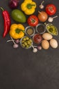 A set of vegetables for a healthy diet, yellow and red peppers, tomatoes, onions, garlic, eggs, olives, rocket,  spinach Royalty Free Stock Photo