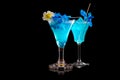 Set of Blue Curacao cocktails garnished with a lime isolated on black background Royalty Free Stock Photo
