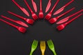 Colorful set of vibrant forks and knife isolated on black