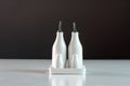 Set of vinegar and oil bottles, salt and pepper shakers on the kitchen table, close-up Royalty Free Stock Photo
