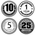 Set of vintage anniversary 1, 5, 10, 25 years round emblems. Retro styled vector decor in black color