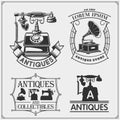 Set of vintage antiques shop labels, badges, emblems and design elements. Royalty Free Stock Photo