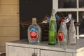 A set of vintage empty glass bottles of beverages