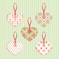 Set of vintage fabric handmade hearts with ribbon and button in shabby chic style Royalty Free Stock Photo