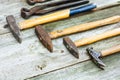 Set of vintage hand construction and carpentry tools hammers on a old wooden background, retro concept Royalty Free Stock Photo