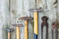 Set of vintage hand construction and carpentry tools hammers on a old wooden background, retro concept Royalty Free Stock Photo