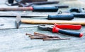 Set of vintage hand construction and carpentry tools hammers on a old wooden background, retro concept Royalty Free Stock Photo