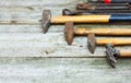 Set of vintage hand construction and carpentry tools hammers on a old wooden background, retro concept Royalty Free Stock Photo