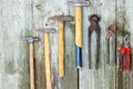 Set of vintage hand construction and carpentry tools hammers on a old wooden background, retro concept Royalty Free Stock Photo