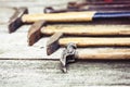 Set of vintage hand construction tools hammers on a wooden background, retro concept Royalty Free Stock Photo