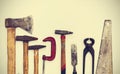 Set of vintage hand construction tools on a white wooden background Royalty Free Stock Photo