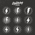 Set of vintage lightning bolts and sunrays on grunge background. Lightnings with sunburst effect. Thunderbolt, electric Royalty Free Stock Photo