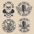 Set of vintage rock and roll emblems on dark background.