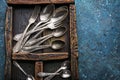 Set of vintage silver cutlery in wooden drawer Royalty Free Stock Photo