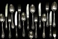 Set of vintage silver spoons and forks isolated on black background Royalty Free Stock Photo