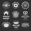 Set of vintage style bakery shop labels, badges, emblems and logo. White graphic art with engraved design elements. Royalty Free Stock Photo