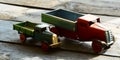 Set of vintage toys - trucks (lorries) toys on blue wooden background Royalty Free Stock Photo