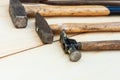 Set of vintage well used hand construction tools for handyman, hammers, on a wooden background