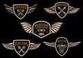 Set of vintage winged emblems. Racing, motorcycles, repair workshop. Design element for logo, label, sign, poster, t shirt.