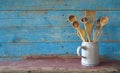 Set of vintage wooden spoons in a mug, kitchen utensils, cooking,food, culinary concept,copy space Royalty Free Stock Photo