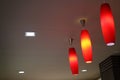 Set of vivid color ceiling pendant lampshades lighting up the warm light Royalty Free Stock Photo