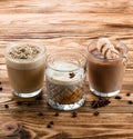 set of warm drinks on a wooden table, cocoa, hot chocolate and Glasse coffee Royalty Free Stock Photo
