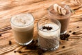 Set of warm drinks on a wooden table, cocoa, hot chocolate and Glasse coffee Royalty Free Stock Photo