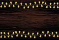 A set of warm light bulb garlands, holiday decorations. The lamps. Glowing Christmas lights. Vector on wooden background Royalty Free Stock Photo