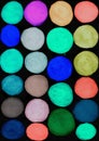 Set of watercolor circles of blue, green, red, brown, mustard, mint colors isolated on black background