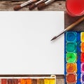 Set of watercolor paints, brushes for painting and blank paper Royalty Free Stock Photo