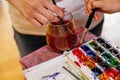 Set of watercolor paints, paintbrush, glass of water, concept for artist painting, Selective focus, Painting concept, Color Royalty Free Stock Photo