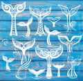 Set of Whales Tail on Rustic Wood Blue Background