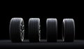 Set of wheels with modern alu rims on black background Royalty Free Stock Photo