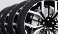Set of wheels with modern alu rims close-up on white Royalty Free Stock Photo