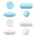 Set of white and blue round and oval medicine pills of various k