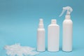 Set of white bottles of cleaning products on a blue background. Front view Royalty Free Stock Photo
