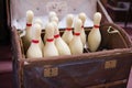 Set of White Bowling Pins inside an open Casket Royalty Free Stock Photo