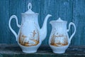 A set of white ceramic dishes from a teapot and a jug with a brown pattern Royalty Free Stock Photo