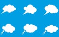 Set of white clouds for thoughts, messages and other records isolated on blue background Royalty Free Stock Photo