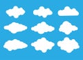 Set of white clouds vector design illustration isolated on blue sky. Cloud icon on blue background. Royalty Free Stock Photo