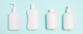 Set of White Cosmetic containers isolated on blue background, top view with copy space. Group of plastic bodycare bottle Royalty Free Stock Photo