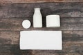 Set Of White Cosmetic Containers On Wooden Background, Top View With Copy Space. Brand packaging mockup Royalty Free Stock Photo