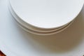 Set of white dishes on white.Stack of plates Royalty Free Stock Photo