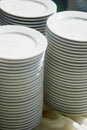 Set of white dishes on white.Stack of plates Royalty Free Stock Photo