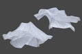 Set of white fluttering silk textile over dark gray background