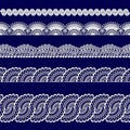Set of white lace ribbons on a blue background Royalty Free Stock Photo