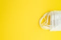 Set of white medical mask isolated on yellow background. Royalty Free Stock Photo